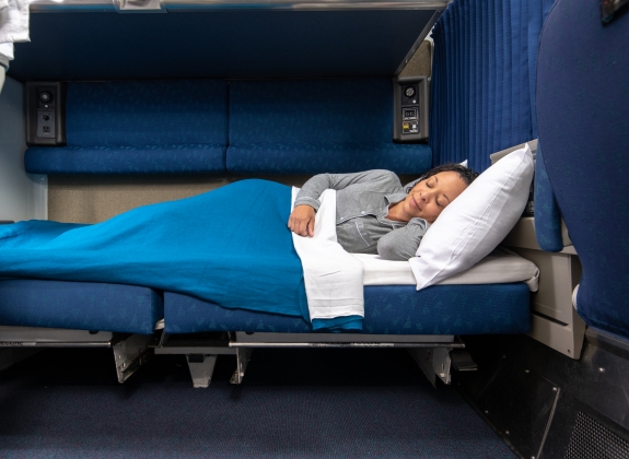 woman laying down in amtrak bedroom