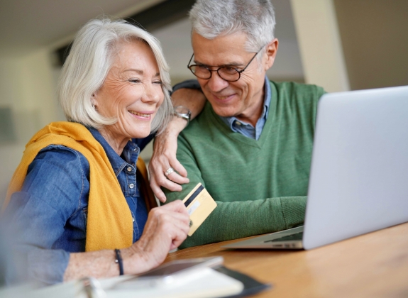 a couple putting down an easy deposit for their train vacation