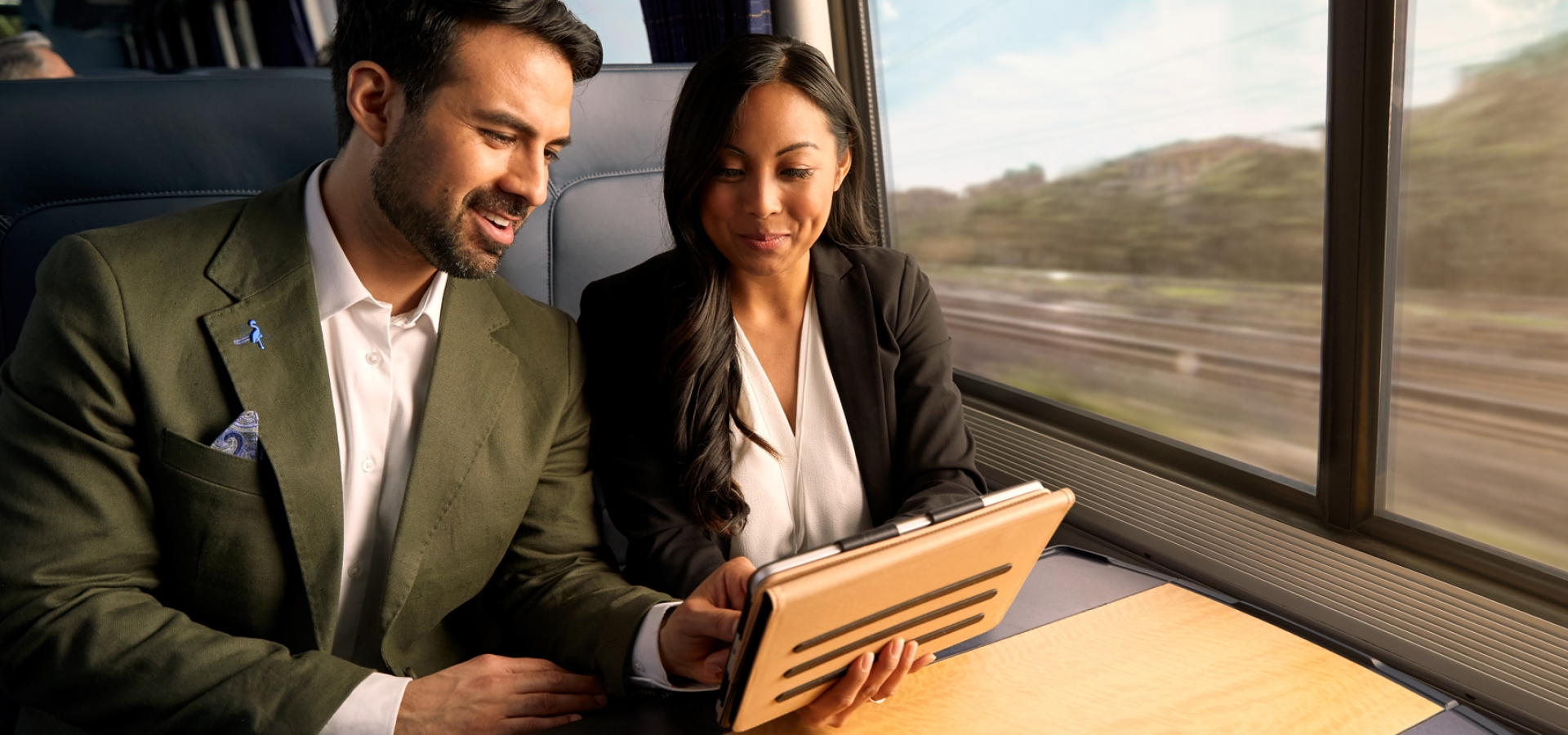two business people on amtrak's acela train